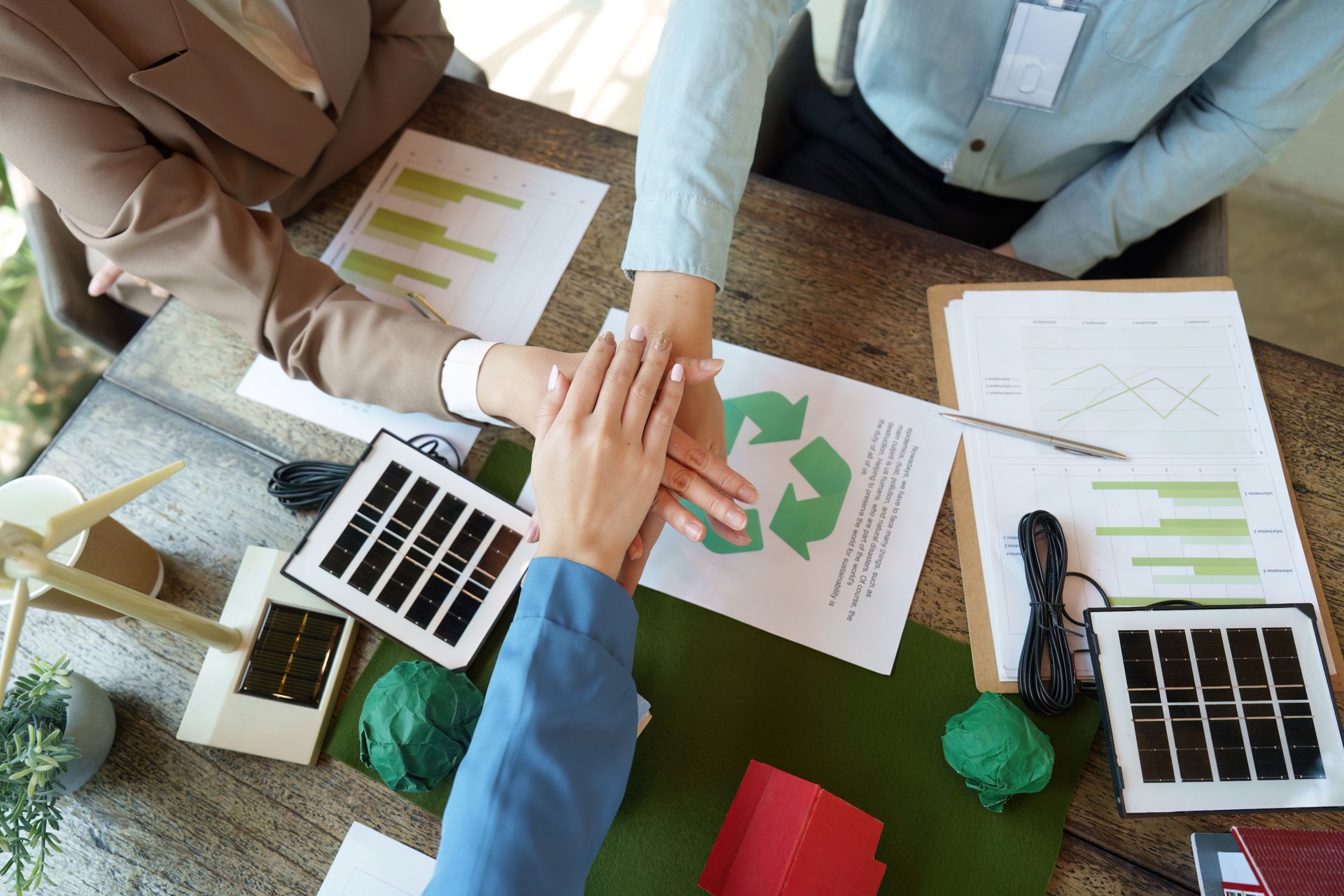 Collaboration and Sustainability. Business professionals engaging in a sustainable project discussion, fostering eco-friendly initiatives.